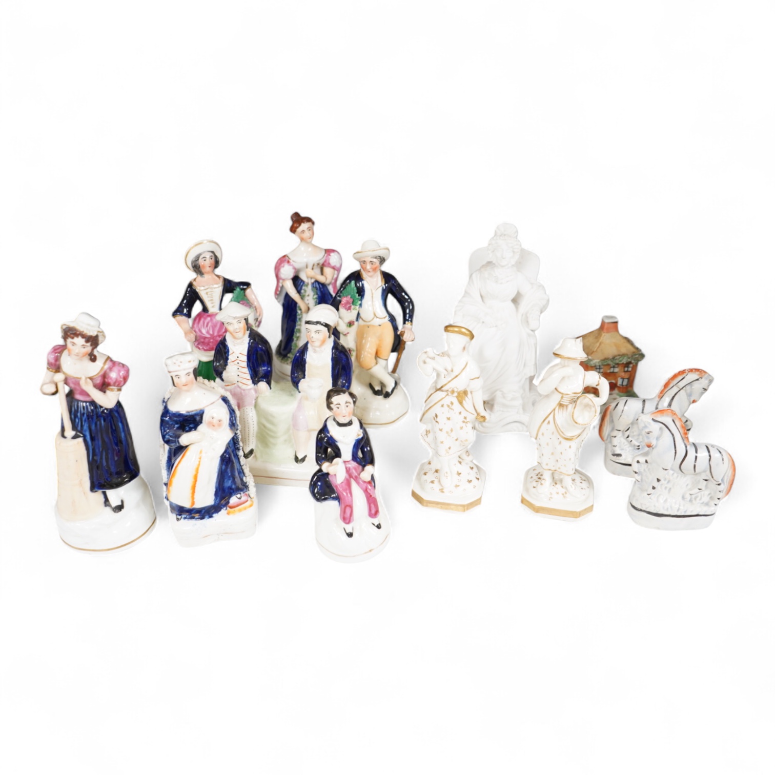 A group of mid-19th century Staffordshire porcelain figures, two models of zebras and a early 19th century Derby biscuit porcelain figure of a seated lady, largest 18cm high
